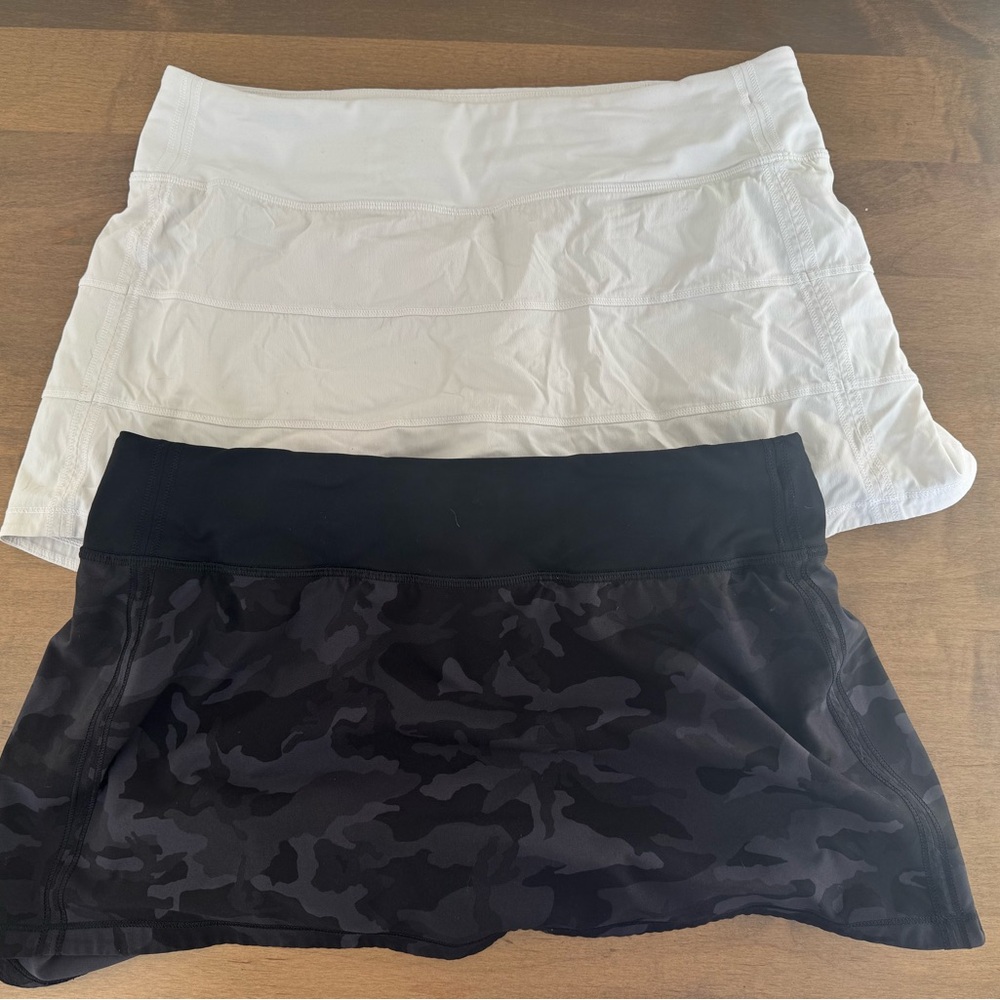 Lululemon 2 pair of women’s shorts size 8,  lined. 1 Black camo and 1 White.